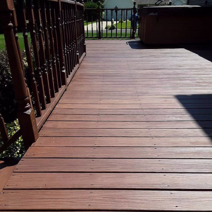 Deck restoration St. Joseph MI - stained deck walkway with black railings