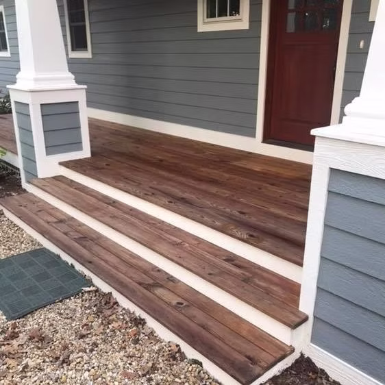 Deck restoration Saugatuck - stained deck stairs beside gray siding