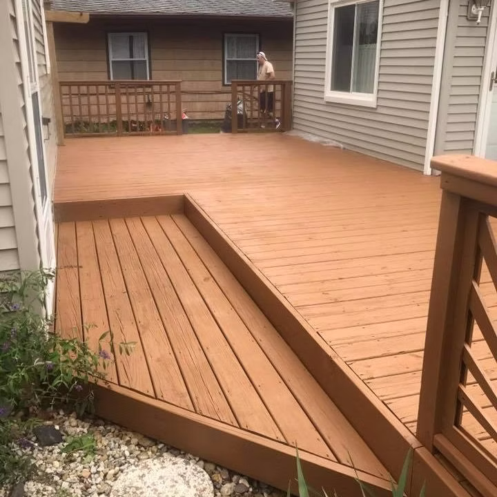 Deck restoration Holland MI - newly stained deck with built-in step