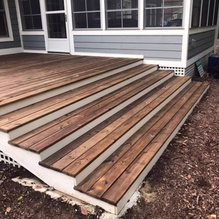 Deck restoration South Haven - wide stained deck steps after restoration